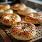 Freshly baked cottage cheese bagels on cooling rack